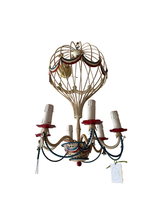 Decorative chandelier shaped like a hot air balloon with ribbons on a white background